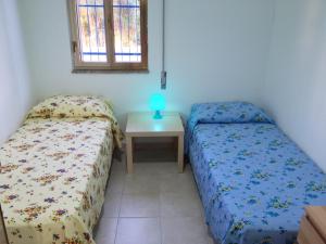 Tempat tidur dalam kamar di La Giara - holiday apartments
