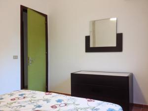 Tempat tidur dalam kamar di La Giara - holiday apartments