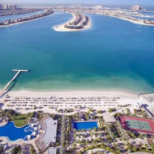 an aerial view of a beach with a resort at Waldorf Astoria Dubai Palm Jumeirah in Dubai