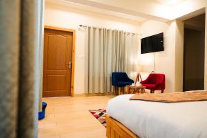 Aaryam Resort, Auliにあるテレビまたはエンターテインメントセンター