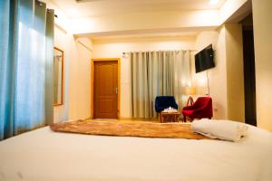 Aaryam Resort, Auliにあるベッド
