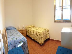 Tempat tidur dalam kamar di La Giara - holiday apartments