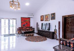 a living room with a rug on the floor at No.8 Boutique Hotel in Ilorin