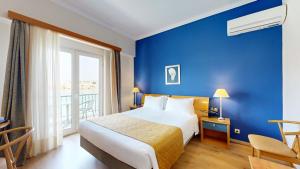 Postel nebo postele na pokoji v ubytování Lucy Hotel