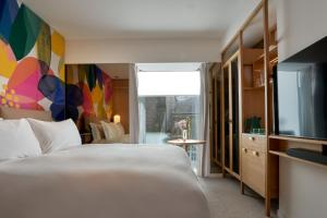 The BoTree - Preferred Hotels and Resorts客房内的一张或多张床位