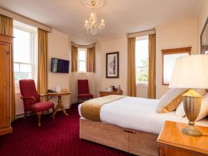 TV a/nebo společenská místnost v ubytování Grant Arms Hotel