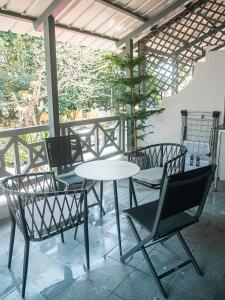 a table and chairs sitting on a patio at Gorgeous KEJ in Pereybere 2 Bed Apartment in Pereybere