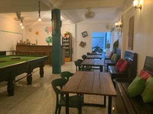 a room with ping pong tables and ping pong balls at La Casa - Thakhek in Thakhek