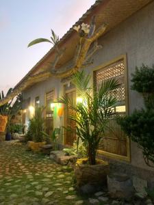 a house with some plants in front of it at Vin vin in Ubud