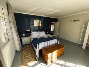 En eller flere senge i et værelse på Dorpsig Cottage