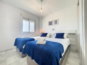 Łóżko lub łóżka w pokoju w obiekcie Hacienda Casares MAGNOLIA 2430