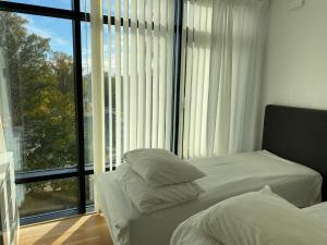 En eller flere senger på et rom på Exclusive 2 level Etage next to Arlanda-City Metro