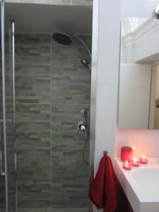 a bathroom with a shower and a sink at LE GEMME DI PERUGIA - alloggi in centro storico - VIA DELLA CUPA / VIA DELIZIOSA in Perugia +73 photos
