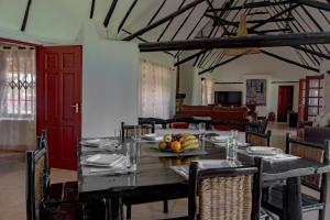 a dining room with a table with fruit on it at Ndoto House-Maanzoni ,Athi River by Nest & Nomad in Machakos