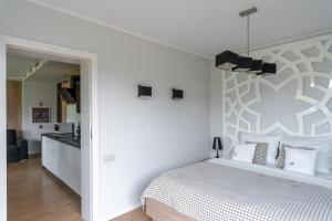 Posteľ alebo postele v izbe v ubytovaní Harenda Residence - Destigo Hotels