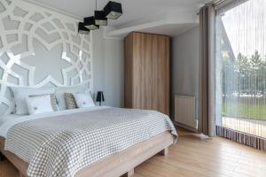Posteľ alebo postele v izbe v ubytovaní Harenda Residence - Destigo Hotels