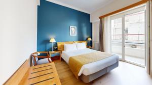Postel nebo postele na pokoji v ubytování Lucy Hotel