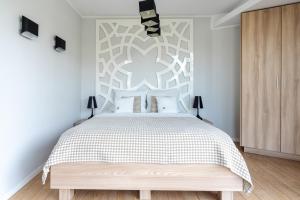 Posteľ alebo postele v izbe v ubytovaní Harenda Residence - Destigo Hotels