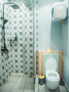 a bathroom with a toilet and a shower at Gorgeous KEJ in Pereybere 2 Bed Apartment in Pereybere