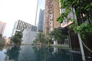 a pool of water in a city with buildings at Lucentia Residence by EAS Maju property in Kuala Lumpur