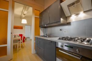 a kitchen with a stove top oven in a room at Spada Apartment in Florence
