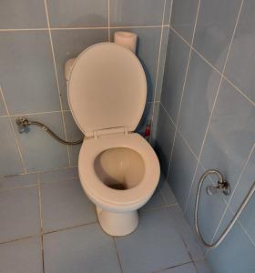 a bathroom with a toilet in a stall at Gabala Garden hostel in Gabala