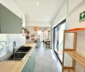 a kitchen with a sink and a counter at Casa Diogo in Faro +11 photos