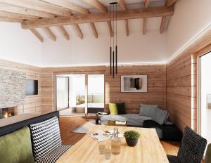 a living room with a table and a couch at VÜ Terrassen-Chalets in Münchberg