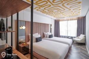 Postel nebo postele na pokoji v ubytování Stayhere Rabat - Agdal 4 - Hotel