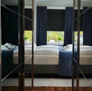 Postel nebo postele na pokoji v ubytování Tromsø Central apartment