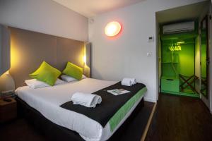 Postel nebo postele na pokoji v ubytování Campanile Hotel & Restaurant Liège / Luik