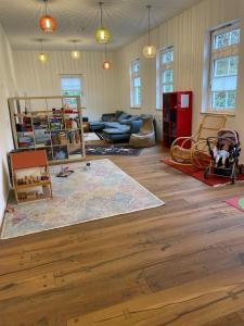 a living room with a map on the floor at "Alte Fabrik" Ferien-und Seminarhaus 