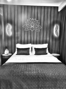 a bedroom with a large bed with a wooden wall at SABIHA GOKCEN HOTEL İSTANBUL HOUSES in Istanbul