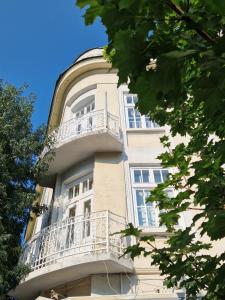 a building with balconies on the side of it at Lambo's Corner Varna in Varna City
