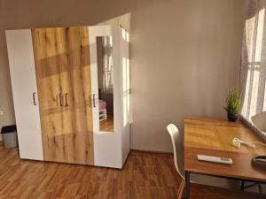a room with a desk and a large wooden door at Lambo's Corner Varna in Varna City