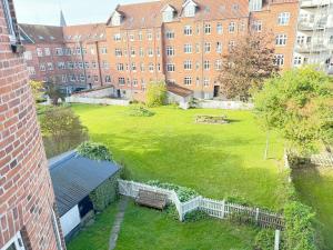 an aerial view of a large green yard with a building at Perfect Apartment For Travelers On A Budget - But Still Wants Quality in Randers