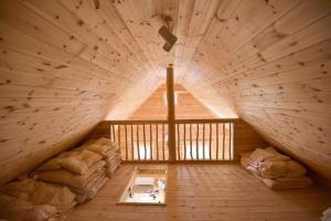 an attic room with a bed and a window at Biwako Hills Resort - Vacation STAY 99556v in Takashima