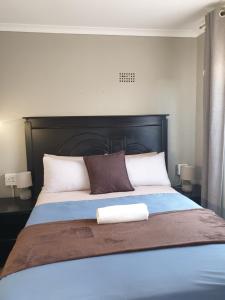 Ένα ή περισσότερα κρεβάτια σε δωμάτιο στο Zondile's guest lodge