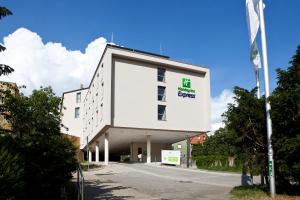 a building with a sign on the side of it at Holiday Inn Express Fürth, an IHG Hotel in Fürth