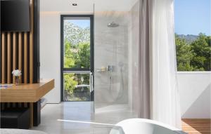 a bathroom with a shower with a glass door at Villa Soiree in Starigrad