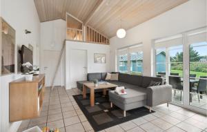 a living room with a couch and a table at Nice Home In Nrre Nebel With Kitchen in Nørre Nebel