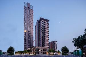 uma representação de um edifício alto com estacionamento em Livetour Hotel Sanxi Metro Guangzhou em Guangzhou