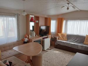 a living room with a couch and a table at 19 Chaffron in Hull