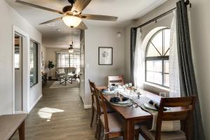 a dining room with a table and a ceiling fan at Pet-Friendly Casa Grande Townhome Screened Atrium in Casa Grande