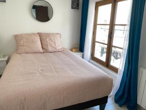 Posteľ alebo postele v izbe v ubytovaní Magnifique logement au pied du Château