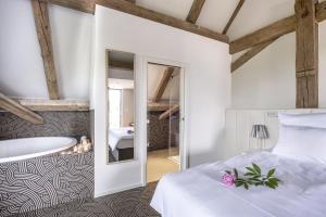 Voodi või voodid majutusasutuse Yard Resort toas
