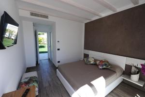 Postel nebo postele na pokoji v ubytování Conero Suites