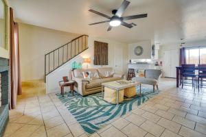 a living room with a couch and a table at San Antonio Townhome 3 Mi to Lackland AFB! in San Antonio