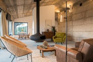 a living room with a couch and a fireplace at Vigias -Eternal Landscapes in Marvão