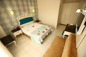 Postel nebo postele na pokoji v ubytování Turk Hotel